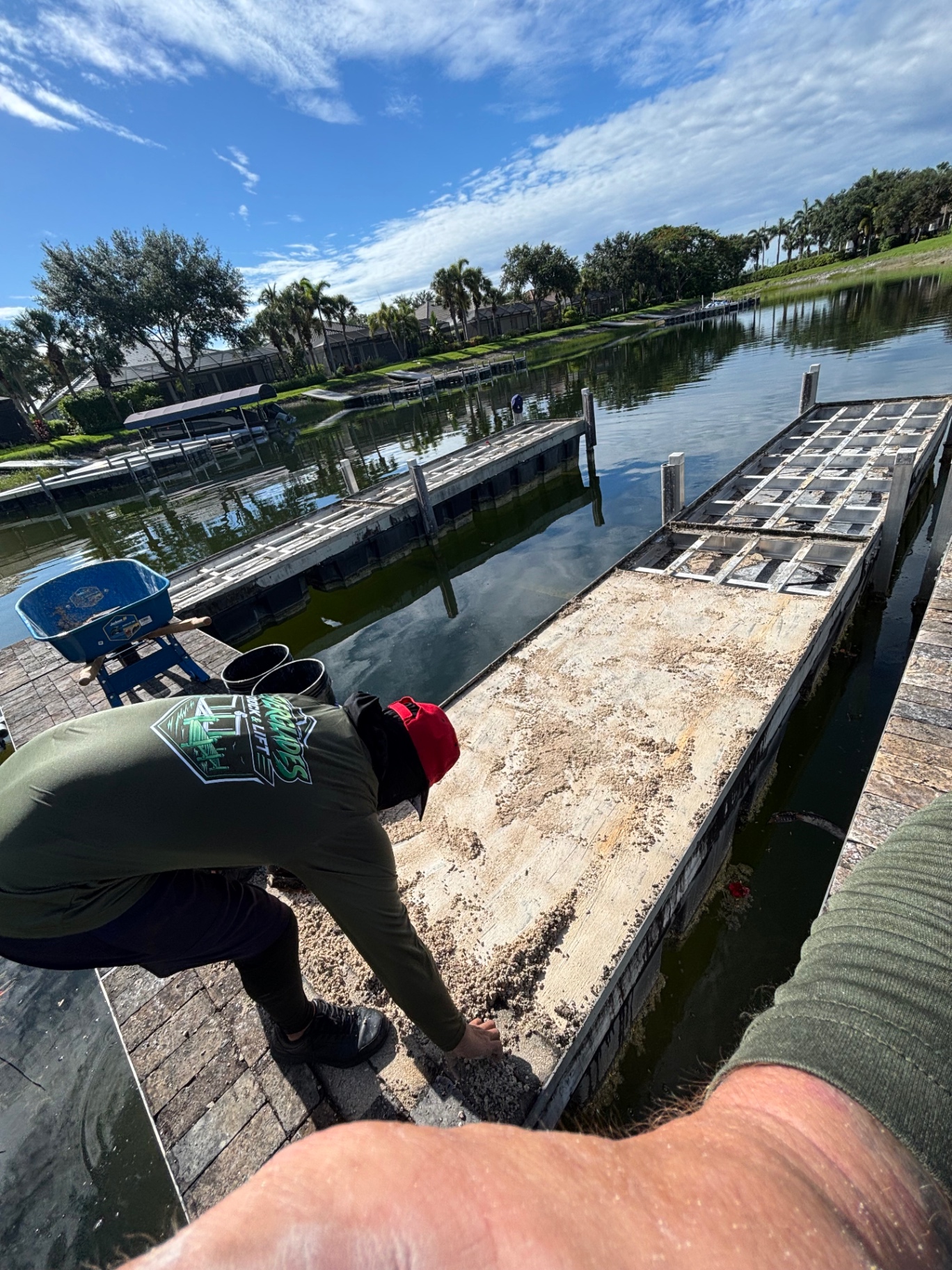 Demo phase — pavers and old cap stripped off down to the aluminum frame. Frame gets inspected, cleaned up and reframed where needed before any new decking goes on.