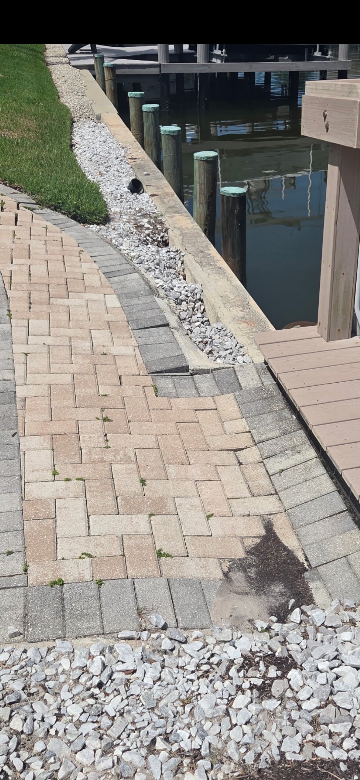 Depression running along the top of the seawall cap. If you can see it from your yard, the leak underwater is already active.