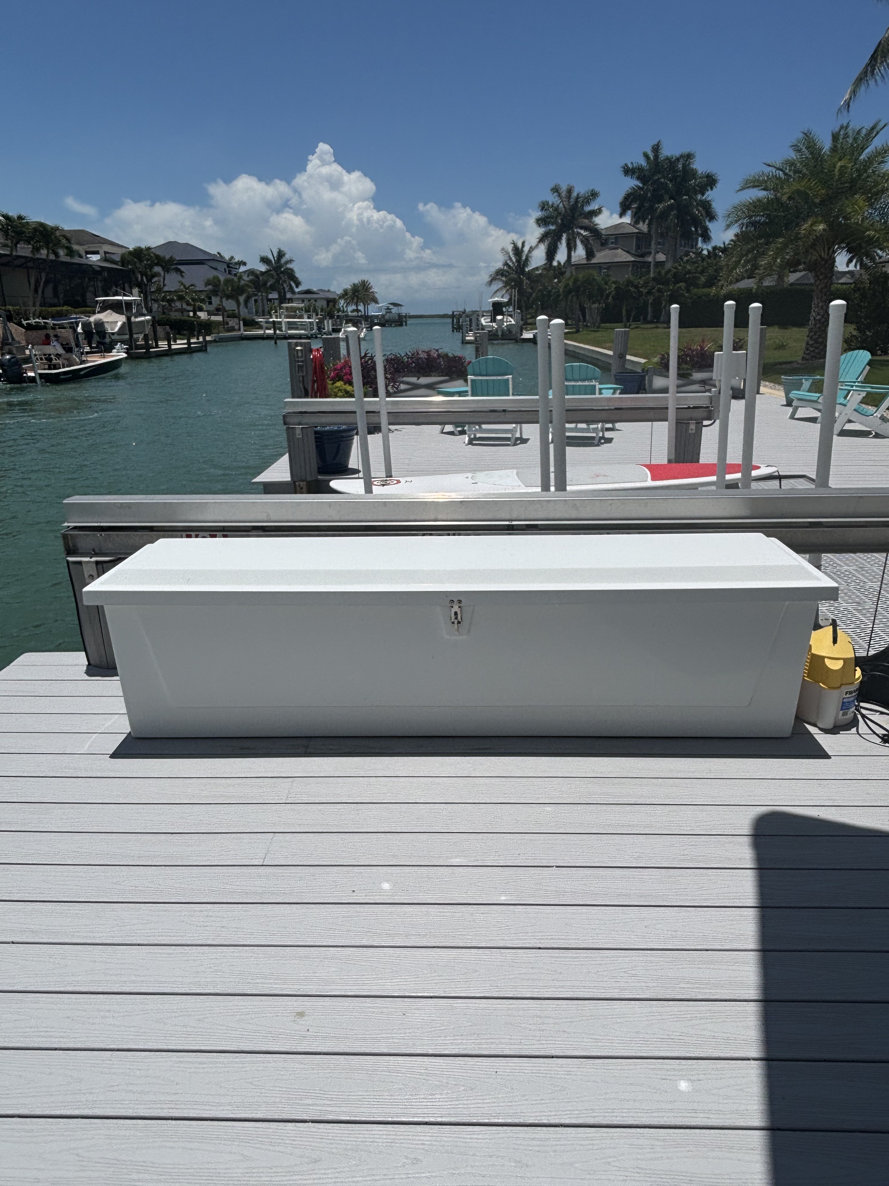 Low-profile dock box for storing lines, fenders, life jackets and gear out of the sun.