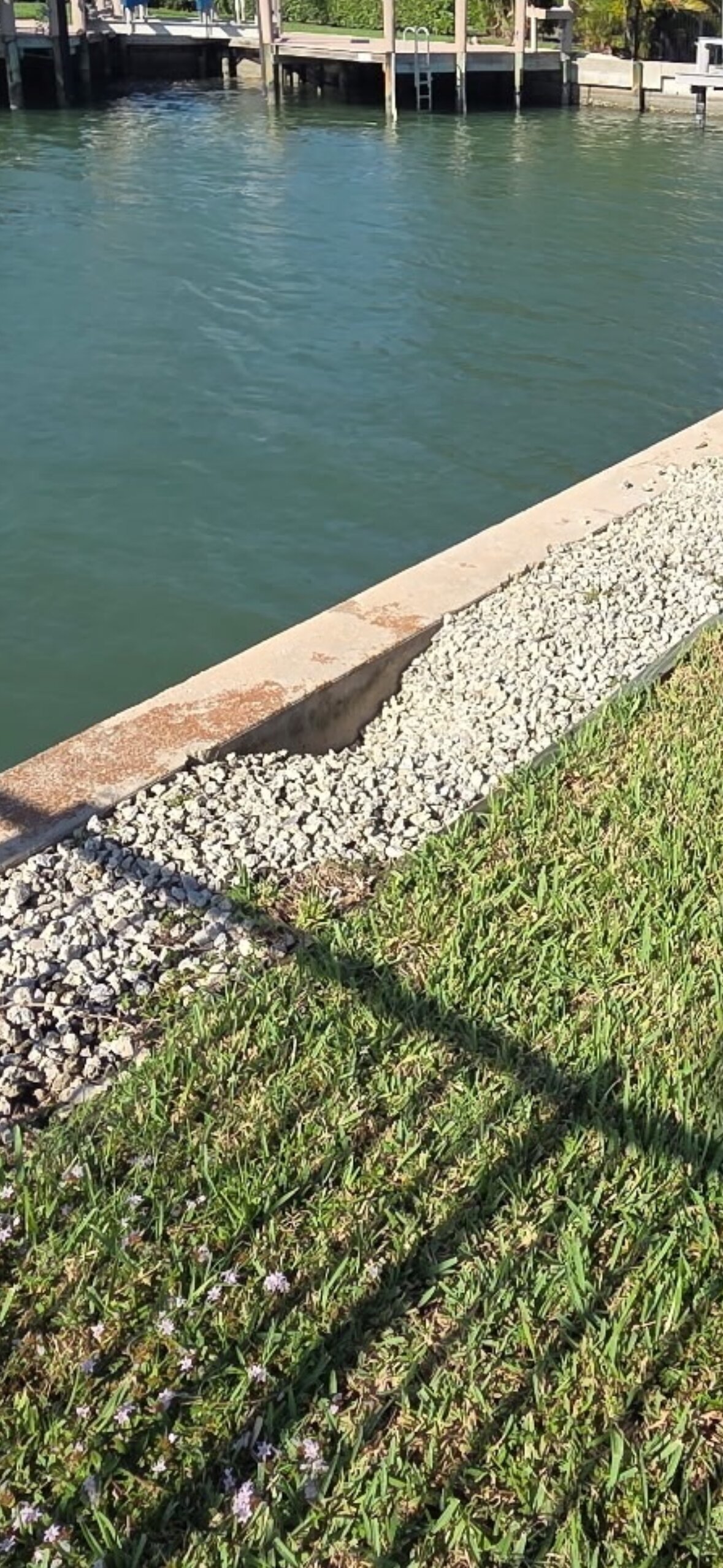 Seawall Leak Warning Signs — Depressions in the French Drain in SW Florida